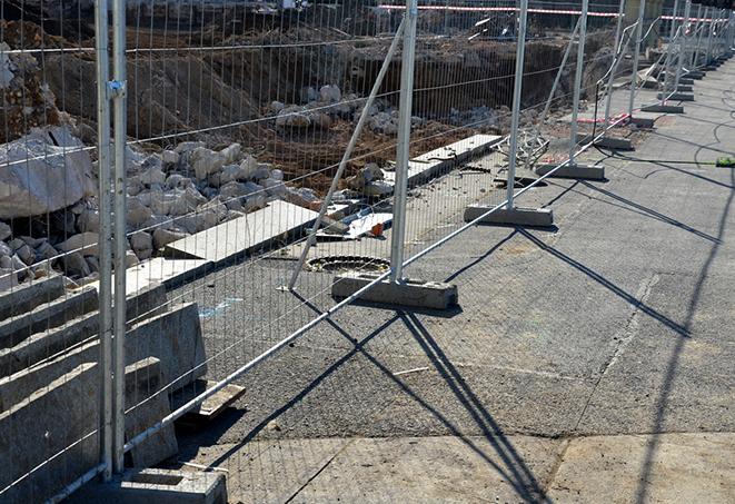 a temporary fence panel used to protect a construction zone from trespassing